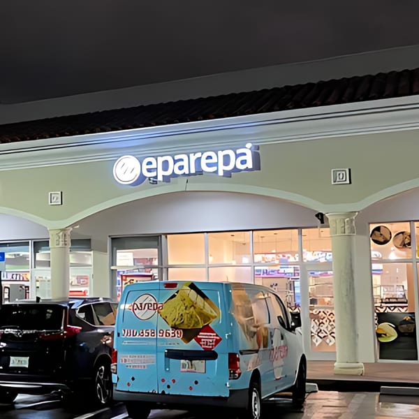 Night view of Eparepa restaurant exterior with a blue delivery van parked in front.